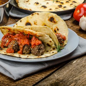 Indian naan with meatballs and tomato sauce