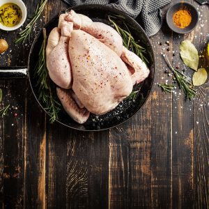 Raw whole chicken ready for cooking